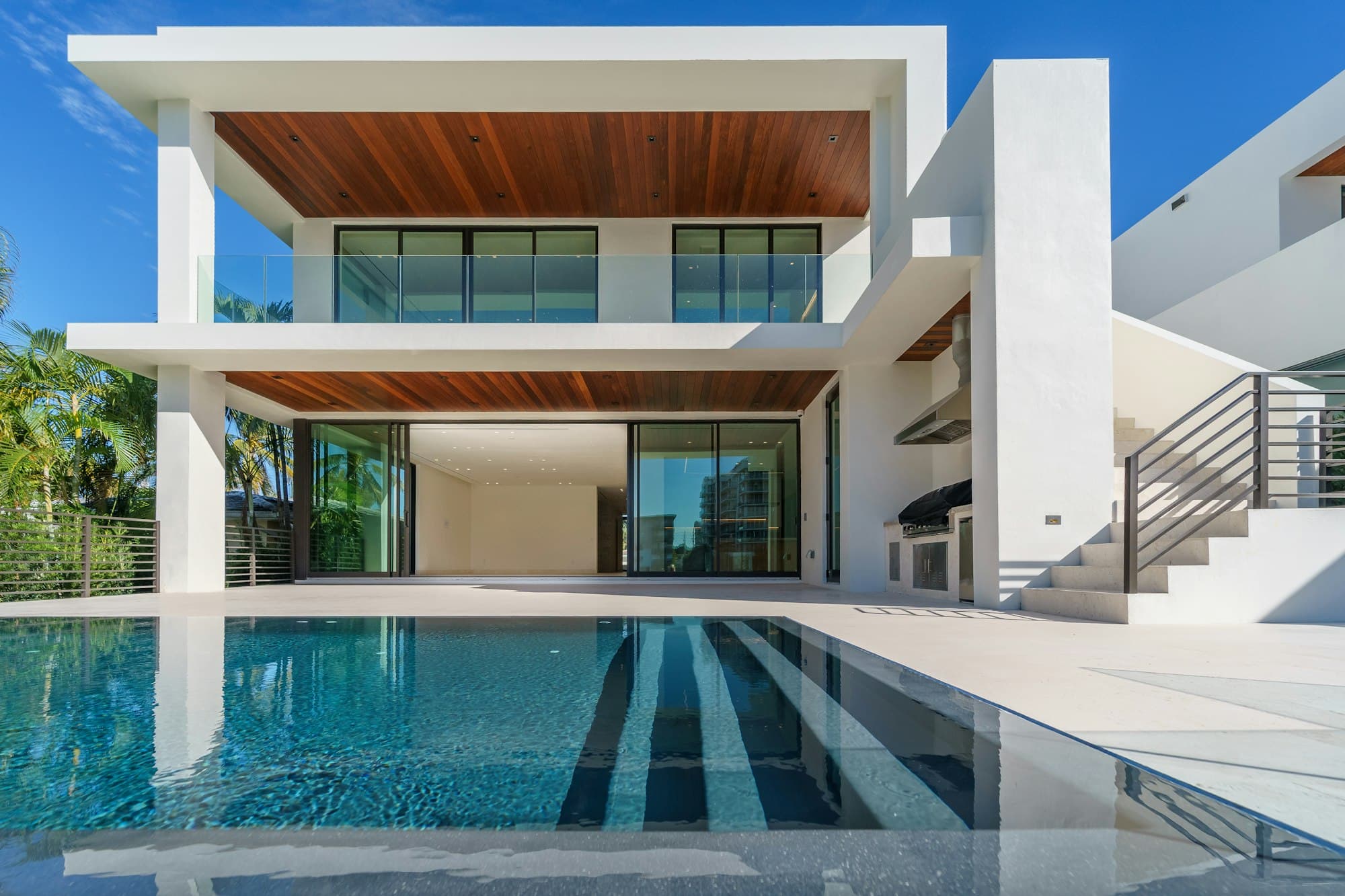 Modern residence with a pool at dusk